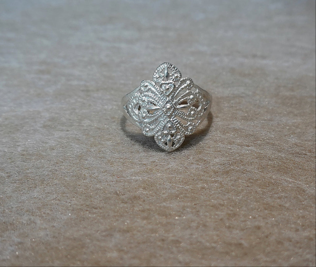 Handmade S999 silver Dancing Blossom ring showing sculptural silver details