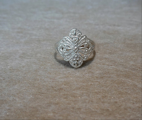 Handmade S999 silver Dancing Blossom ring showing sculptural silver details