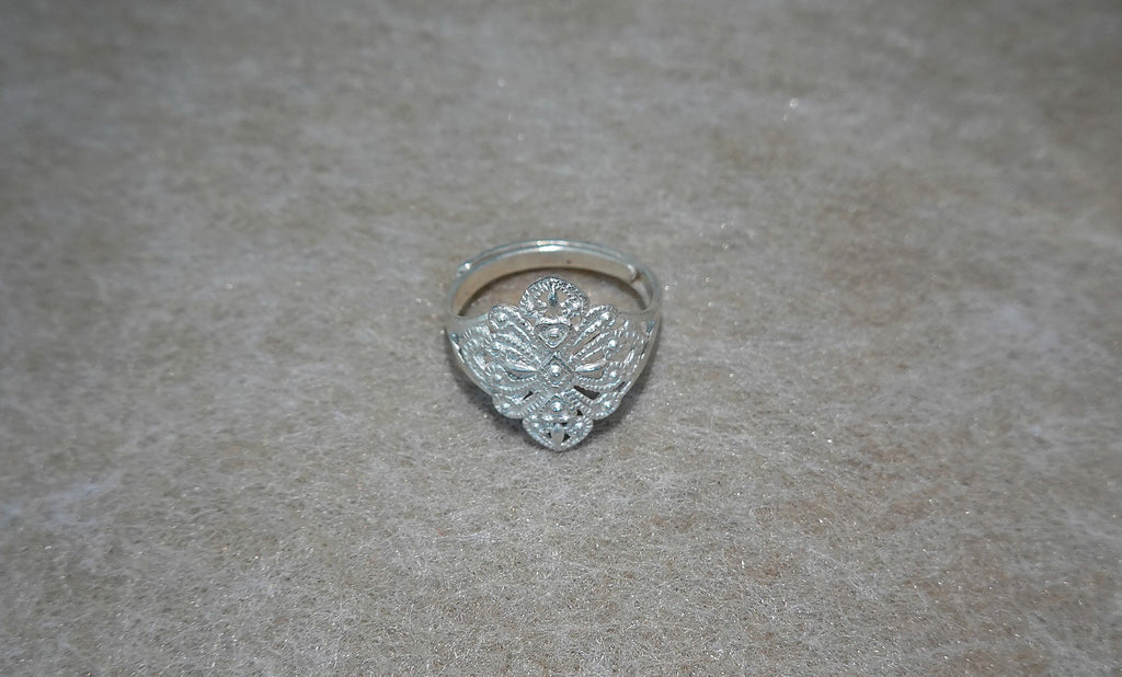 Handmade S999 silver Dancing Blossom ring showing sculptural silver details