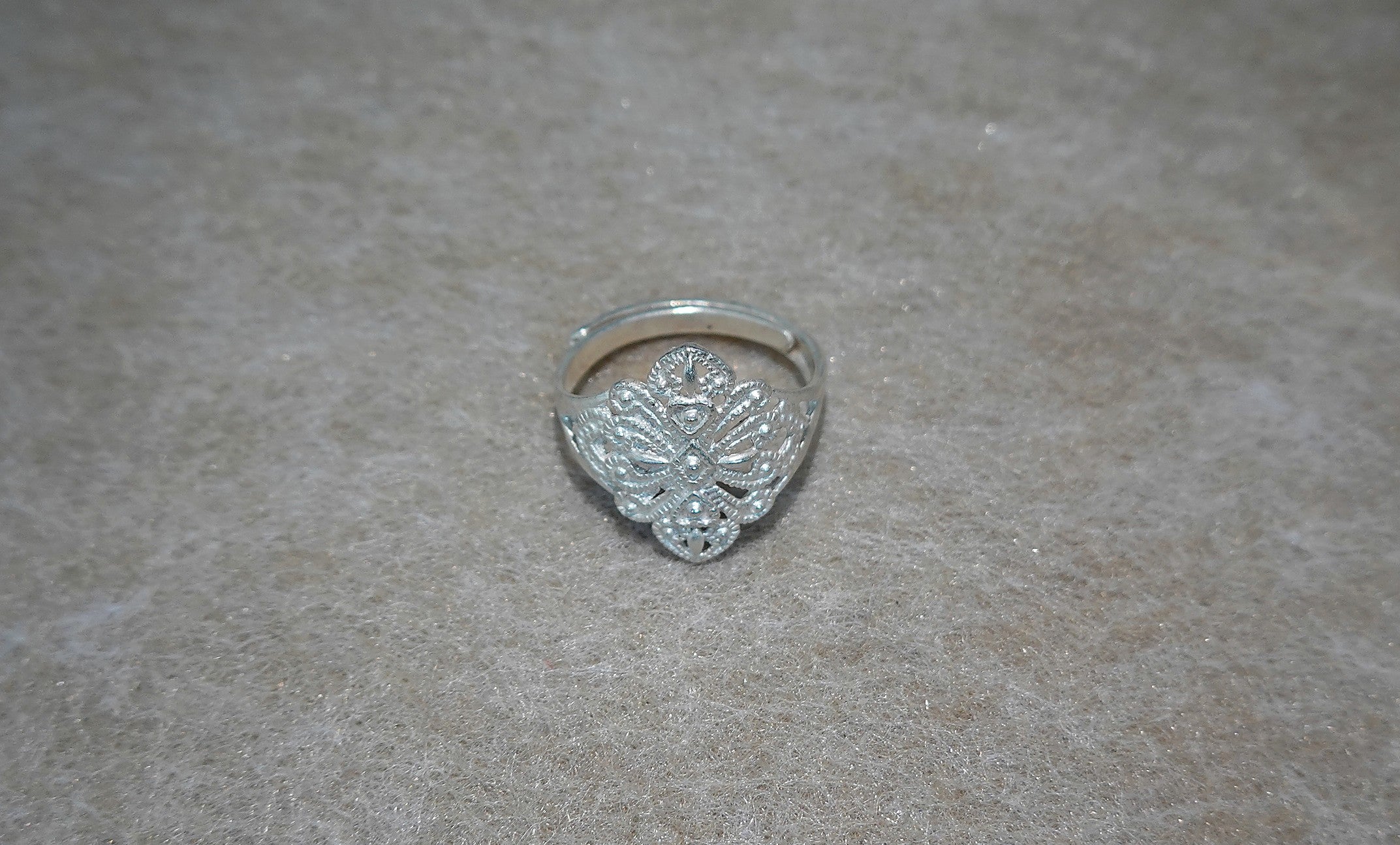 Handmade S999 silver Dancing Blossom ring showing sculptural silver details