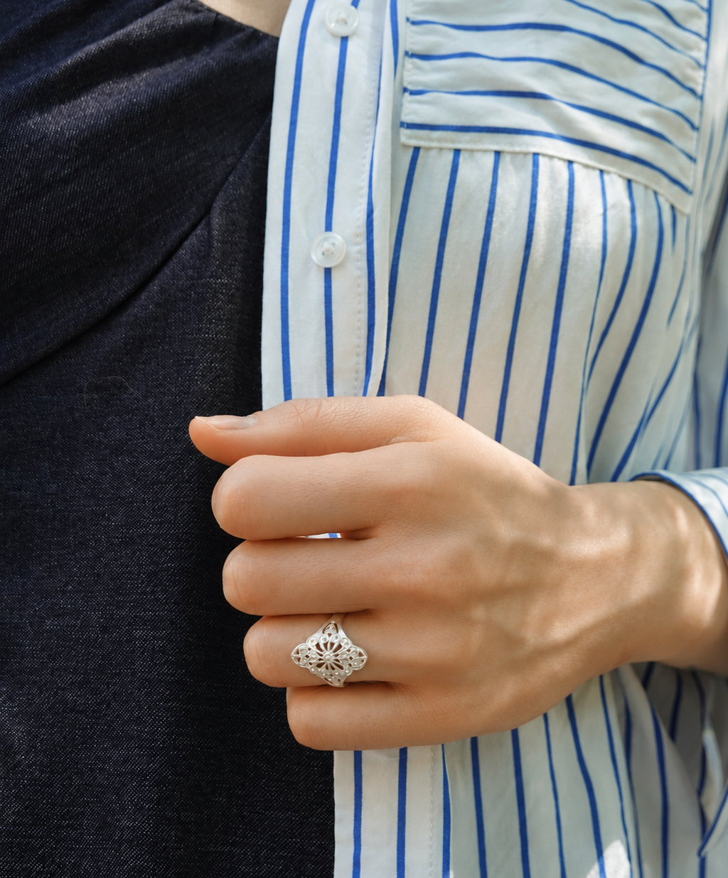 LIOMON Dancing Blossom silver ring worn in natural everyday styling