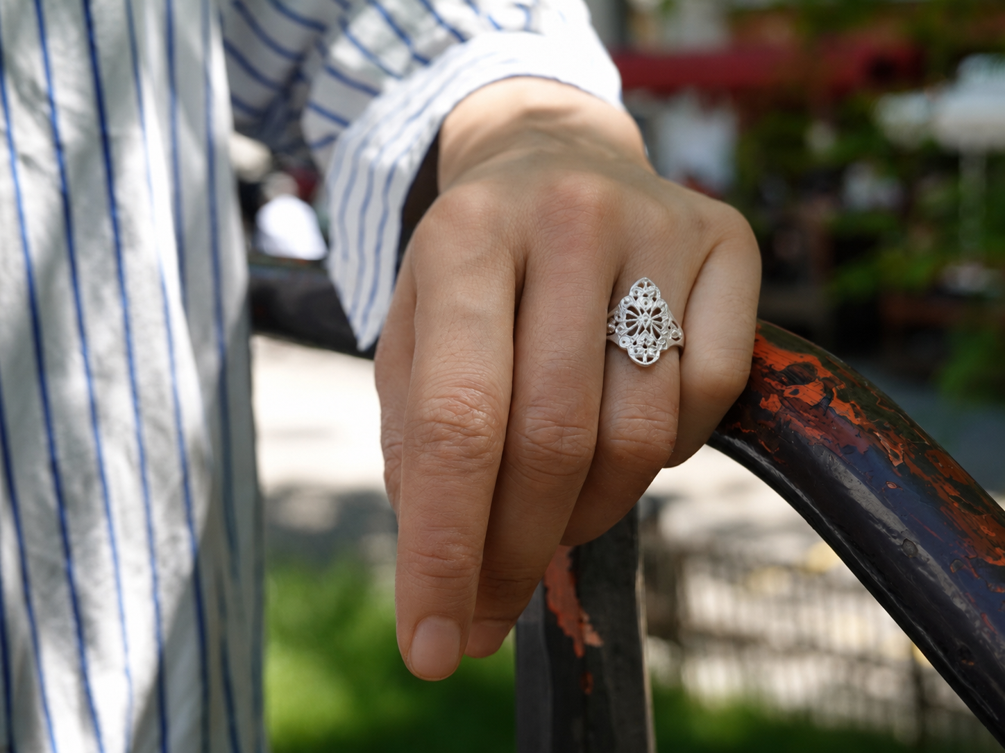 LIOMON Dancing Blossom silver ring worn in natural everyday styling