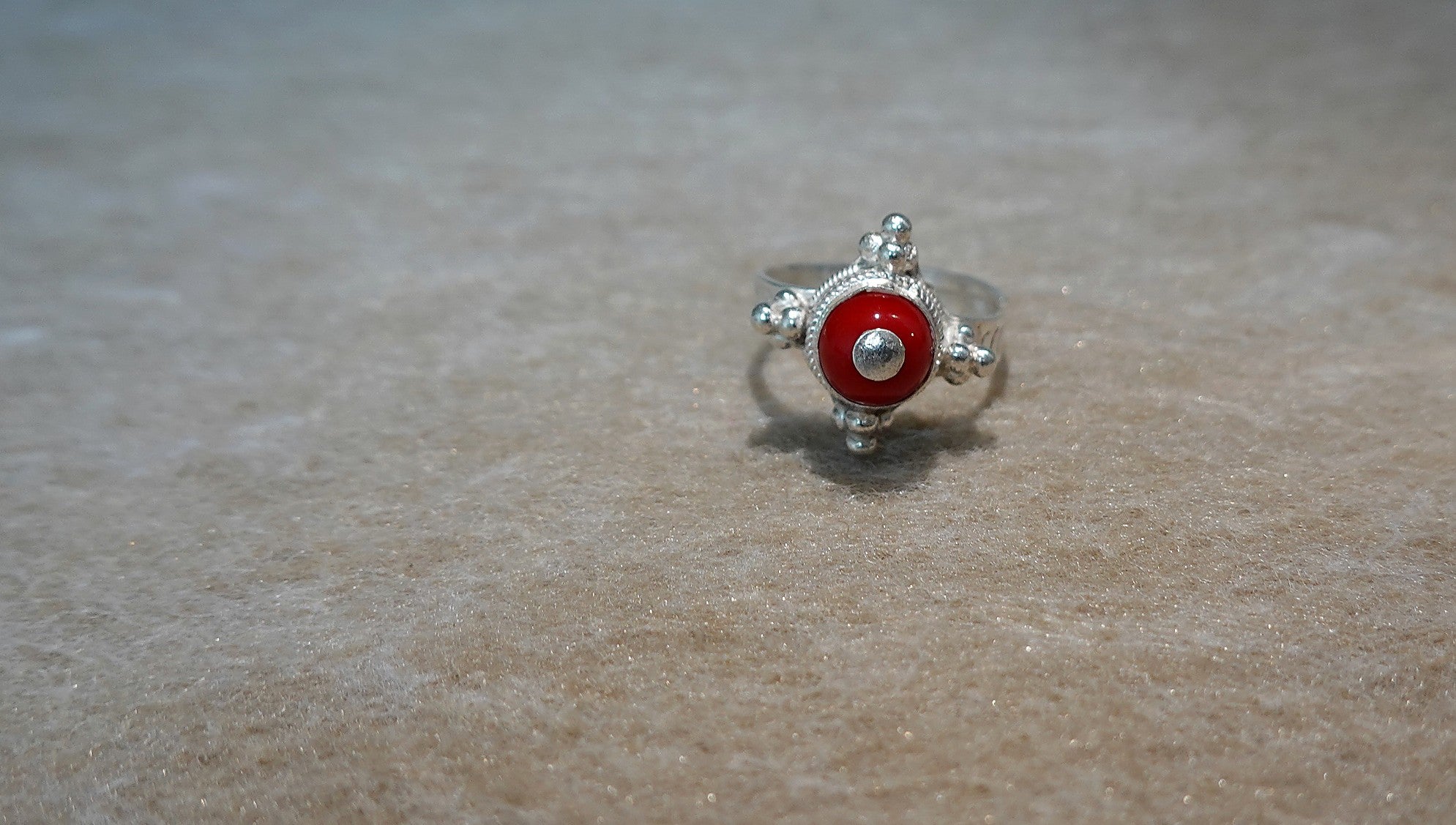 Handmade S999 silver Ember Star ring showing sculptural silver details