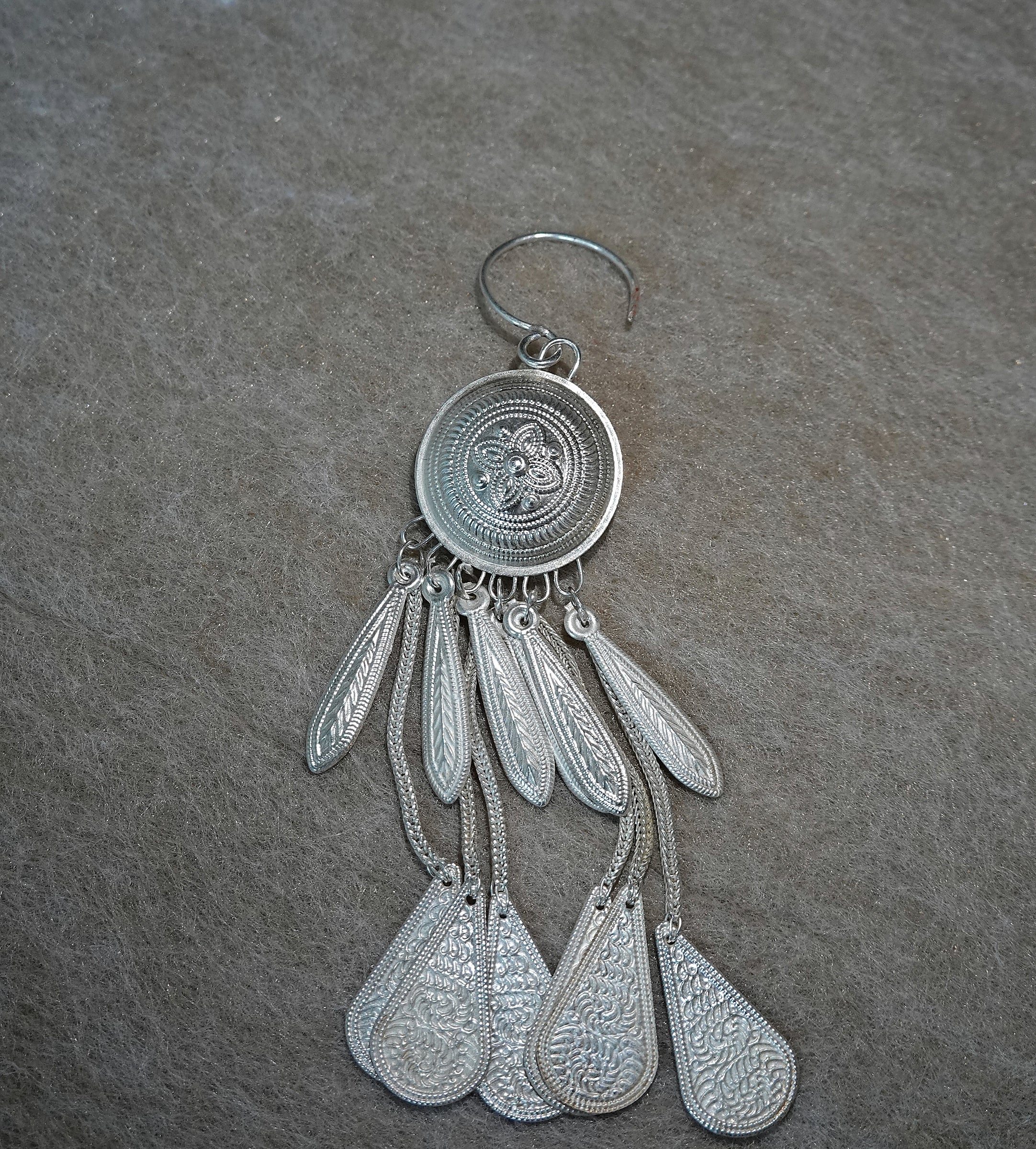 Yi-inspired silver tassel earring with engraved handmade details