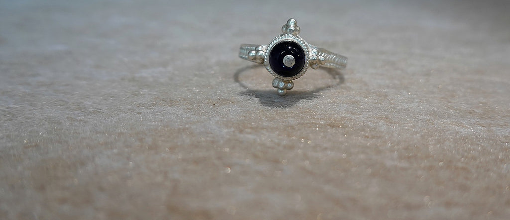 Handmade S999 silver Midnight Star ring showing sculptural silver details