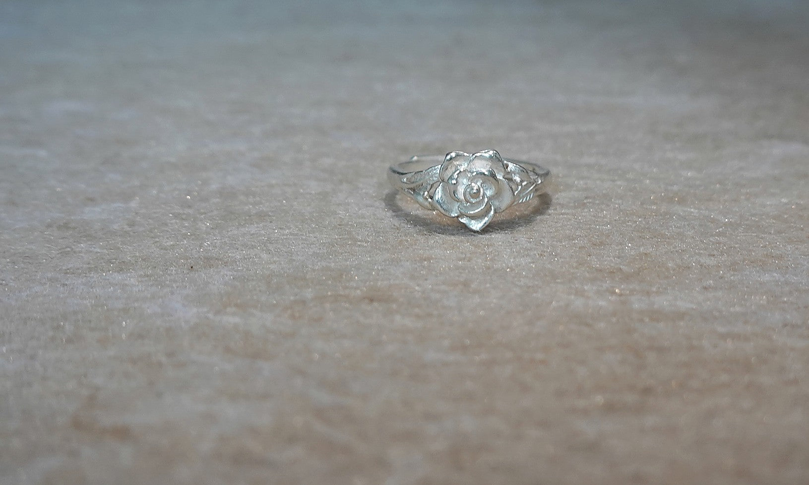 Handmade S999 silver Silver Rose Bloom ring showing sculptural silver details