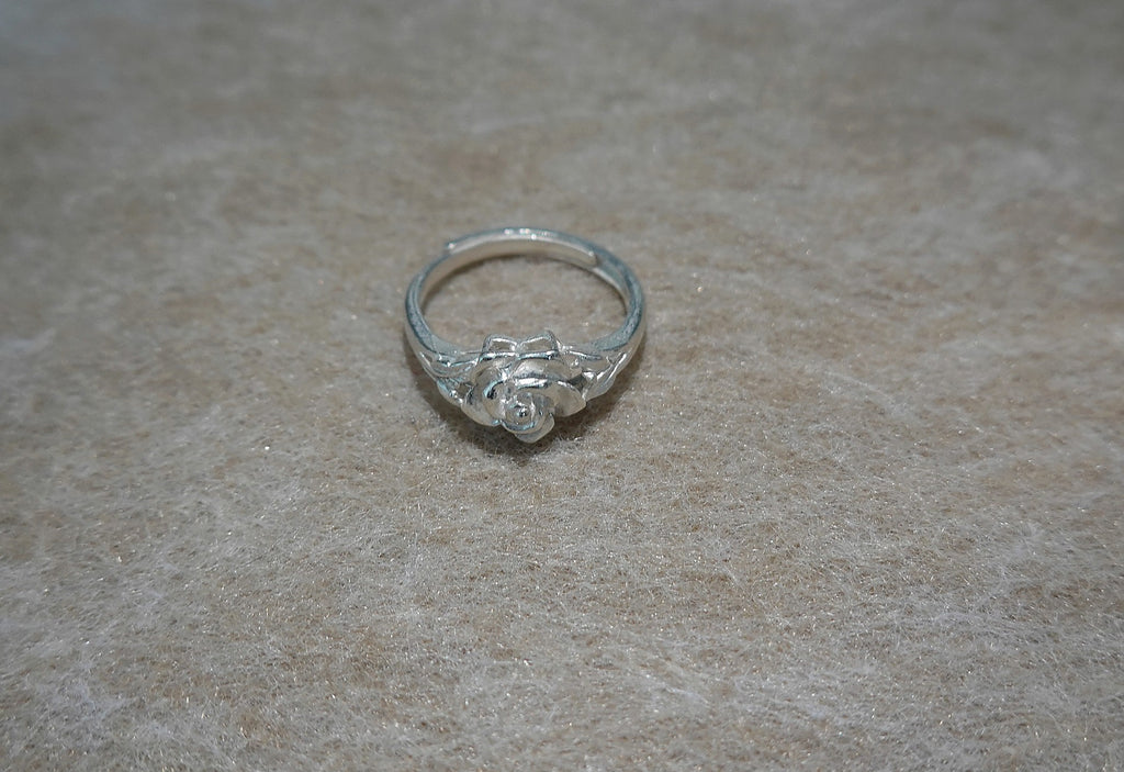 Handmade S999 silver Silver Rose Bloom ring showing sculptural silver details