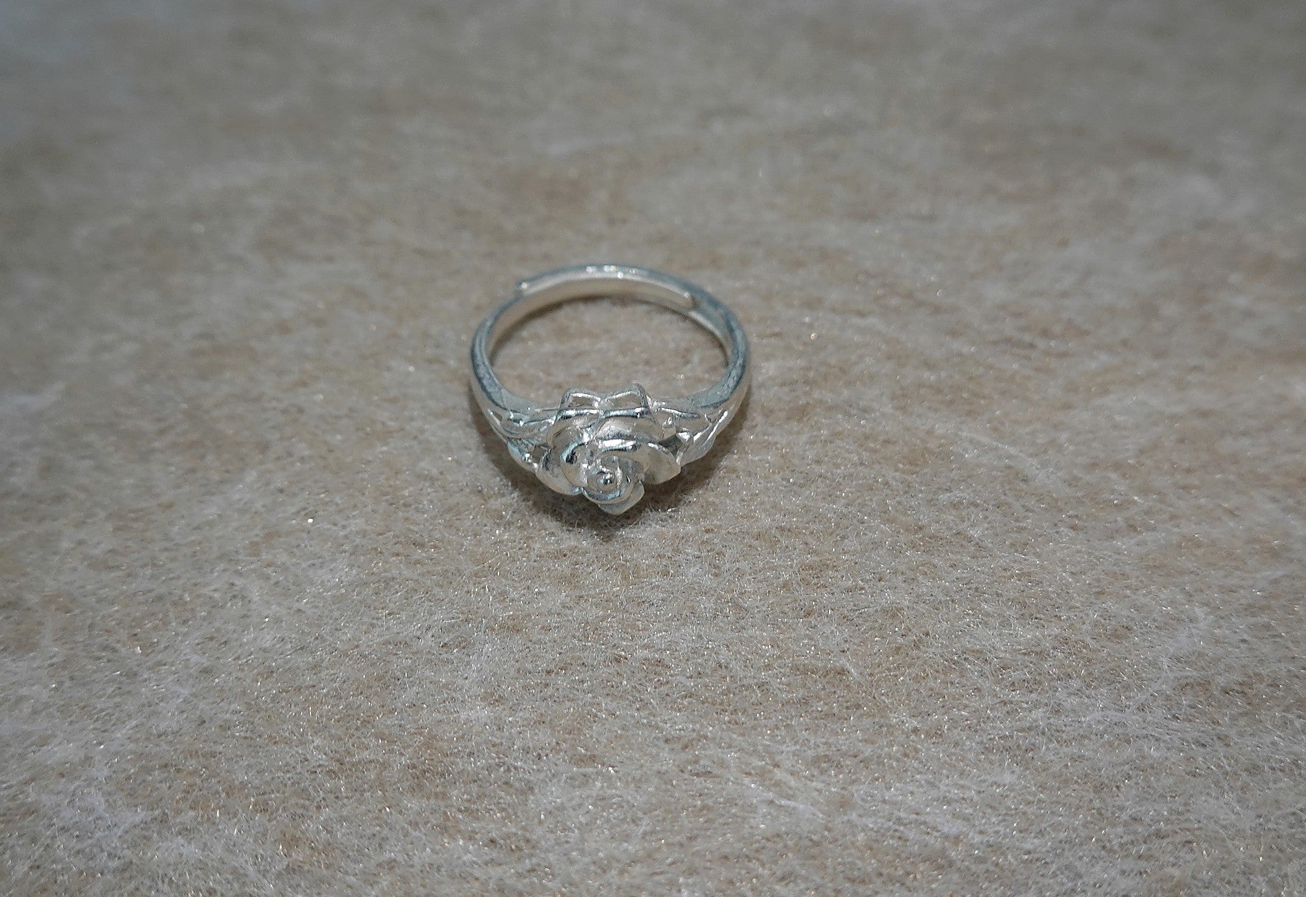 Handmade S999 silver Silver Rose Bloom ring showing sculptural silver details