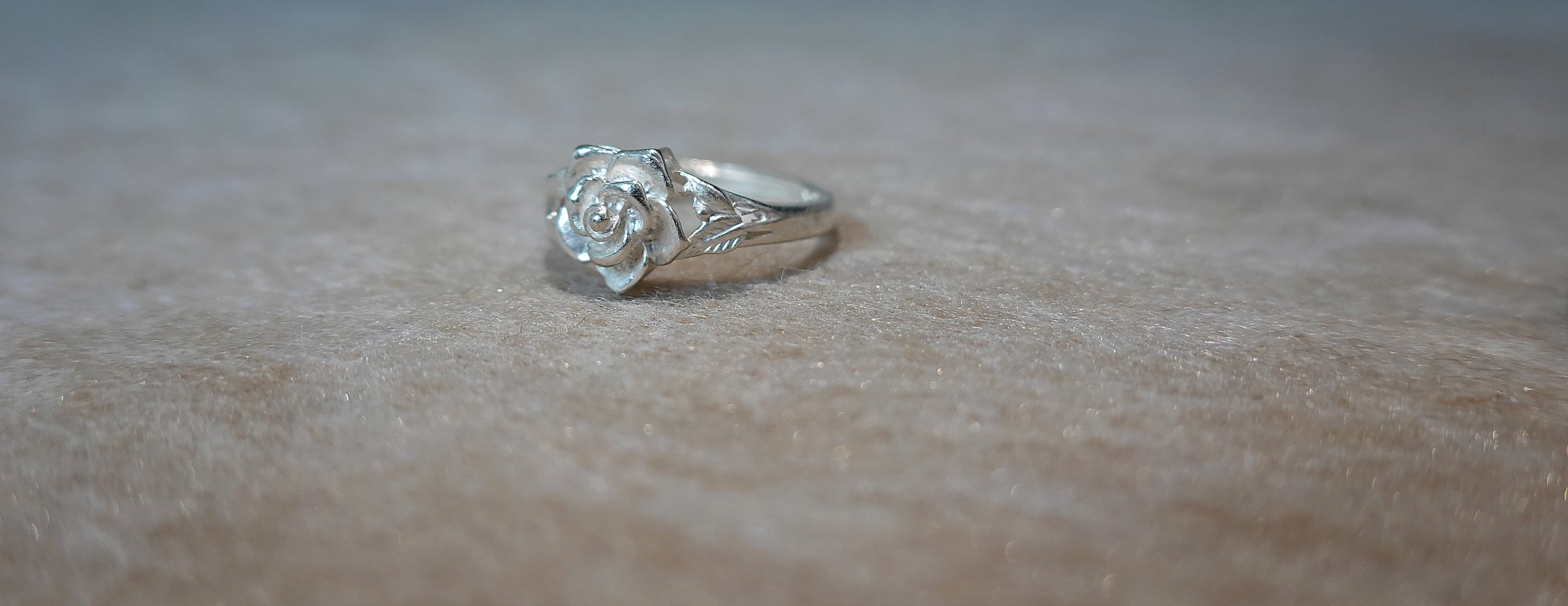 Handmade S999 silver Silver Rose Bloom ring showing sculptural silver details
