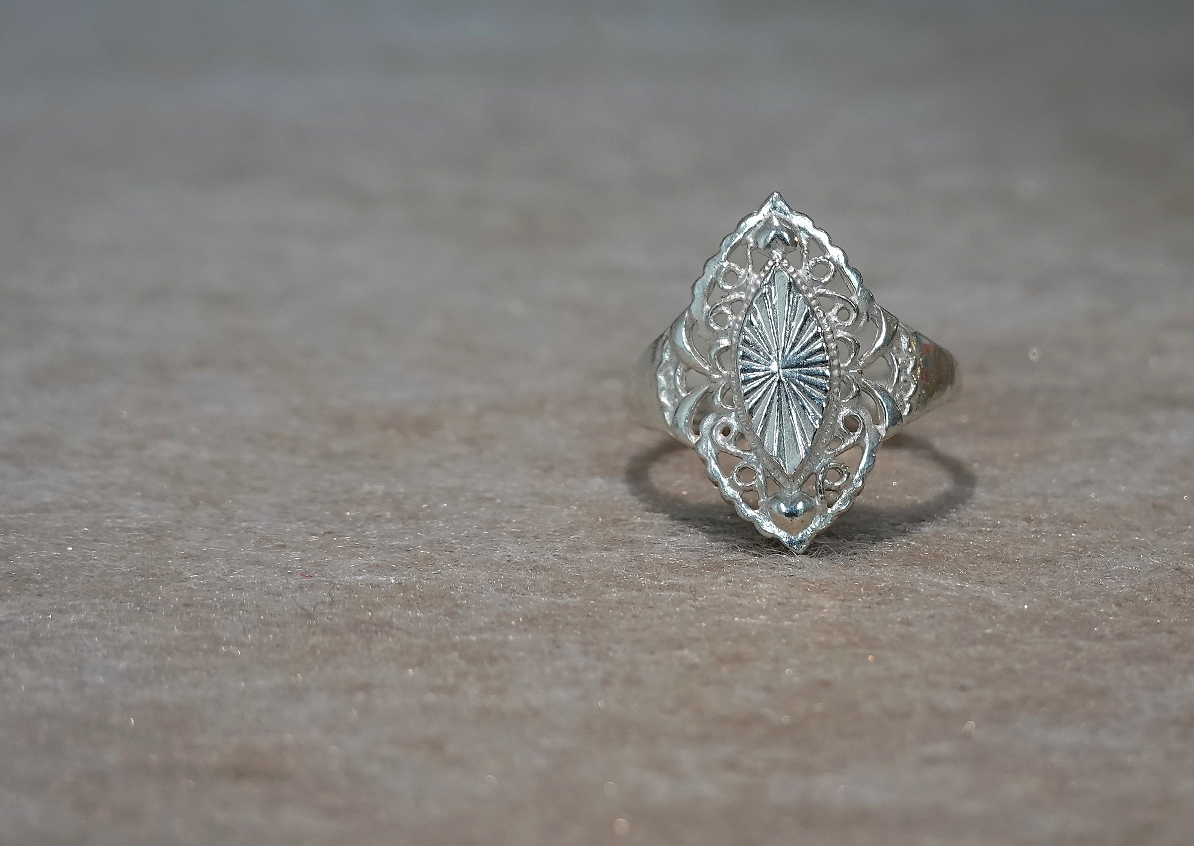 Handmade S999 silver Sunlit Leaf ring showing sculptural silver details