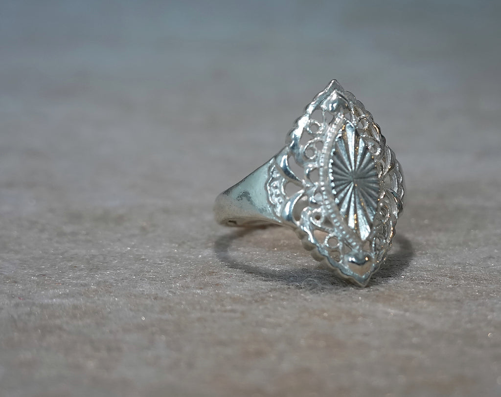 Handmade S999 silver Sunlit Leaf ring showing sculptural silver details