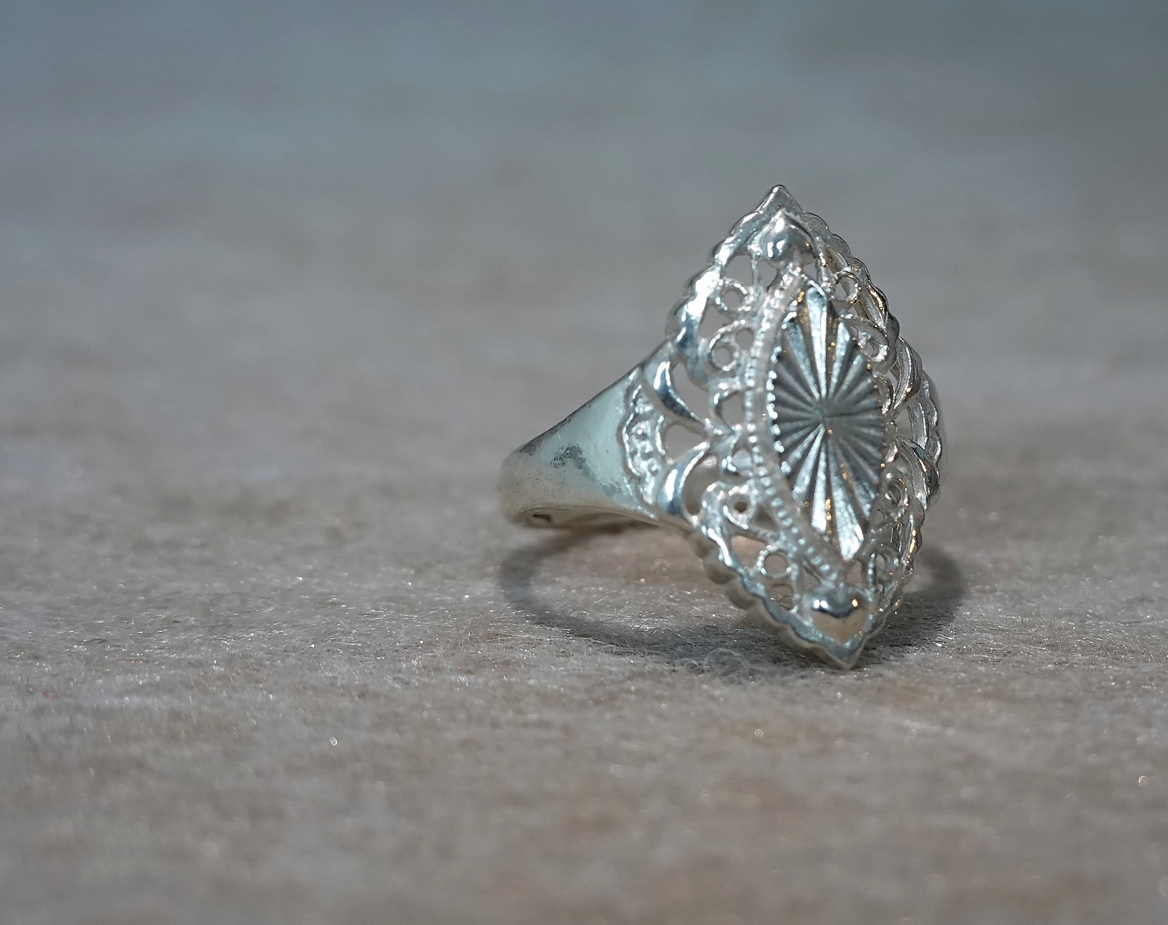 Handmade S999 silver Sunlit Leaf ring showing sculptural silver details